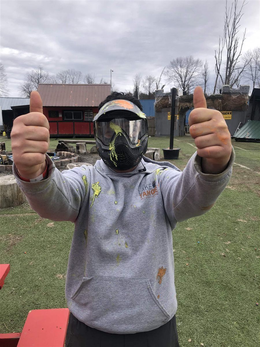 Armaan in paintball gear giving a thumbs up during Brotherhood Games