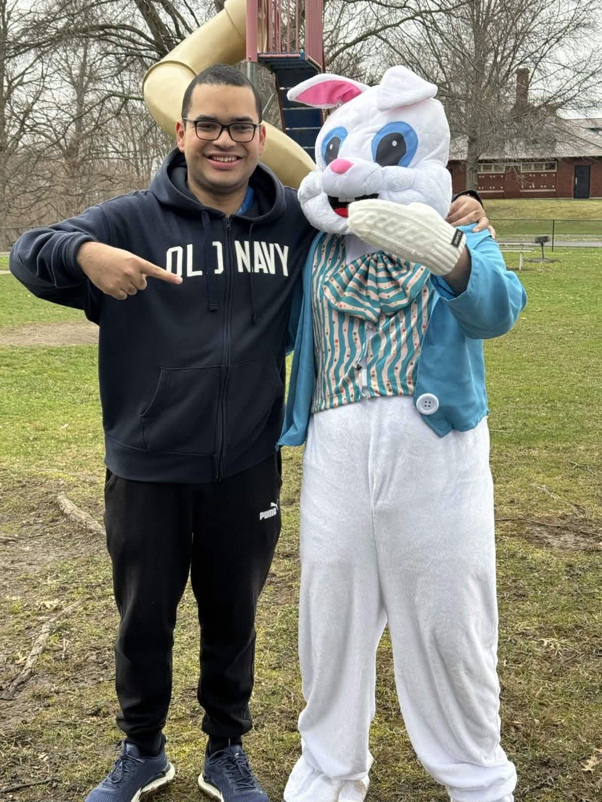 Armaan pointing at the Easter Bunny mascot at the Youth Service Day Easter celebration
