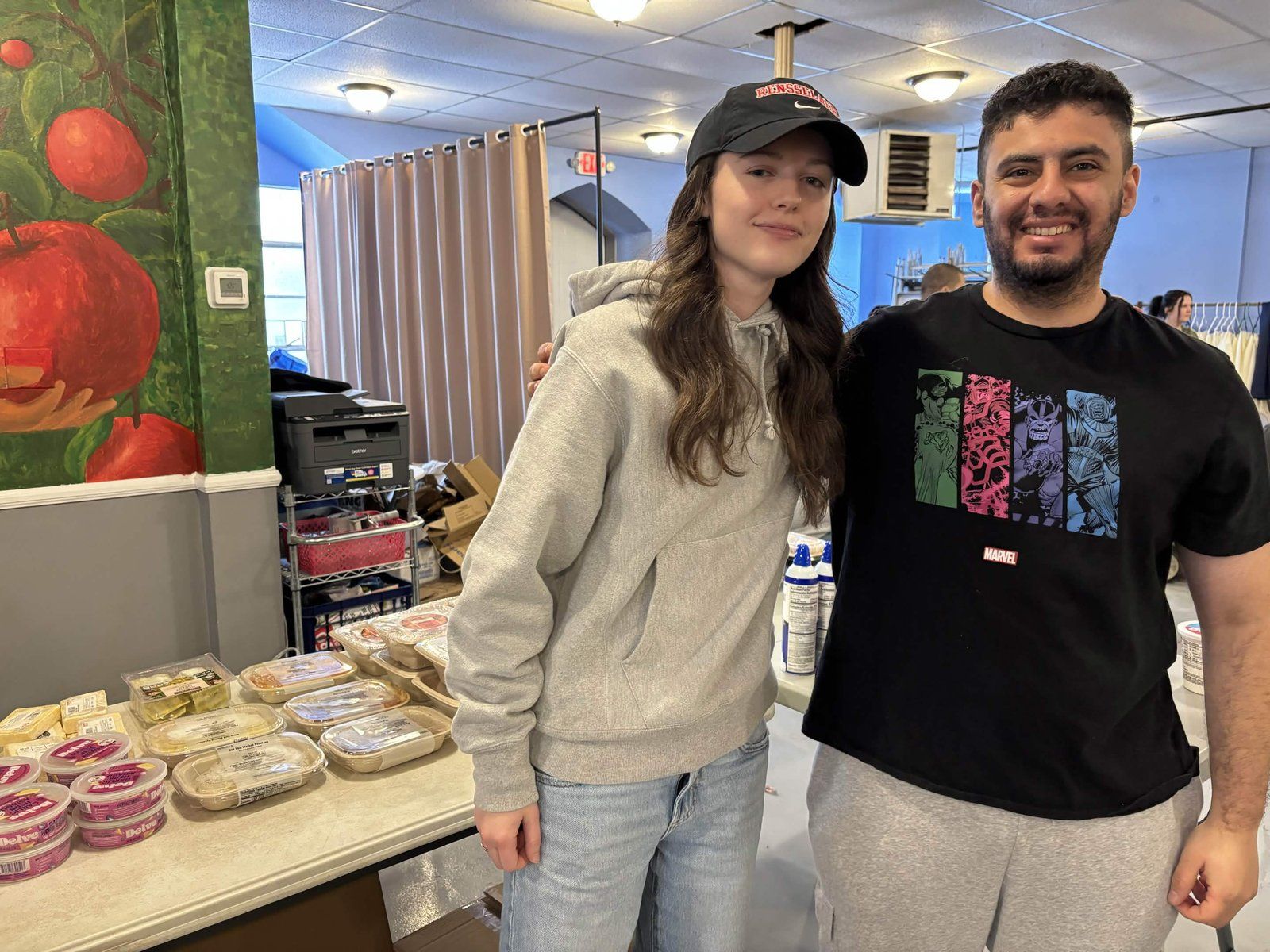Alpha Phi Omega members packaging donated food for a community service project