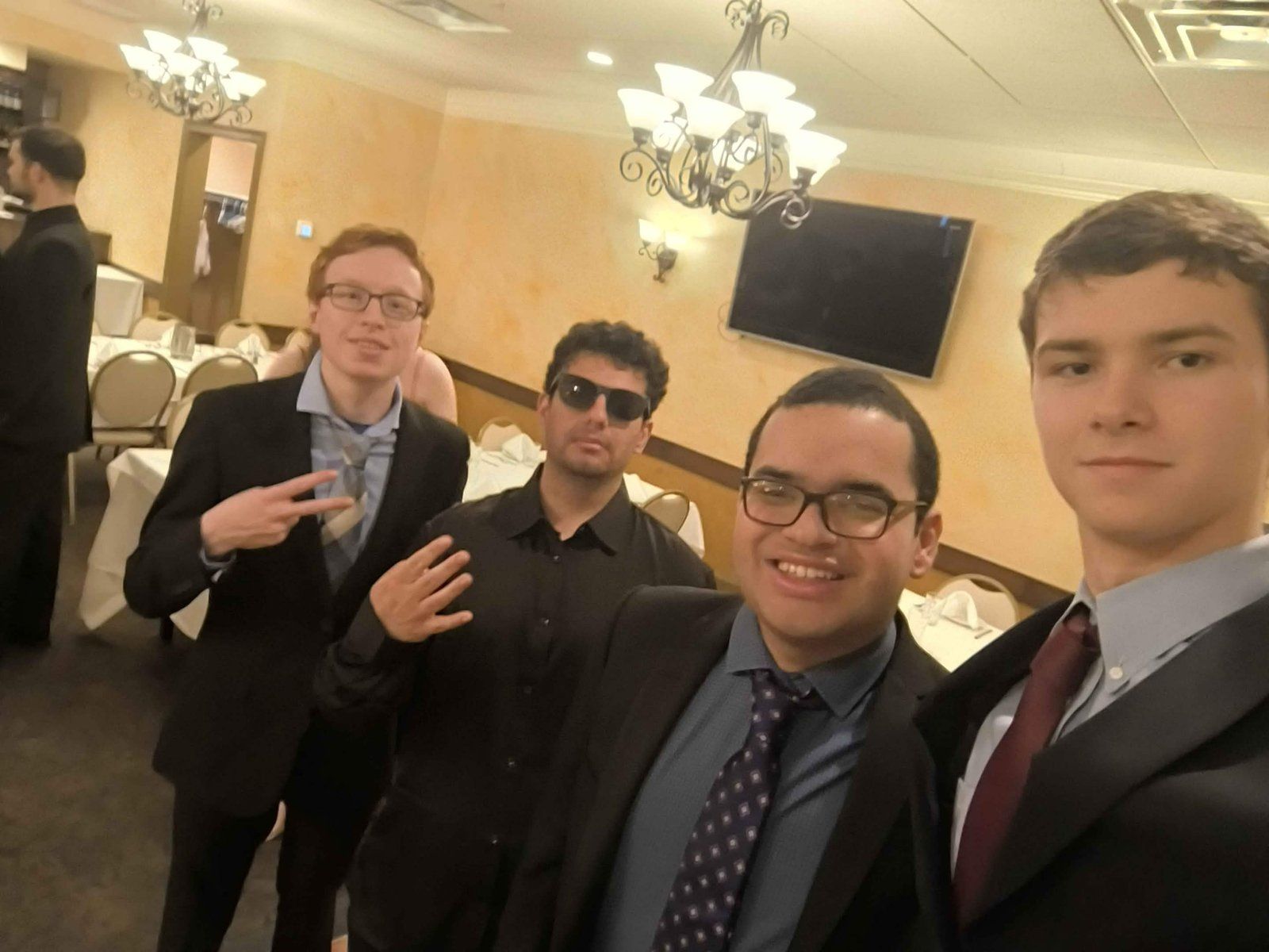Alpha Phi Omega members dressed up at the chapter Formal