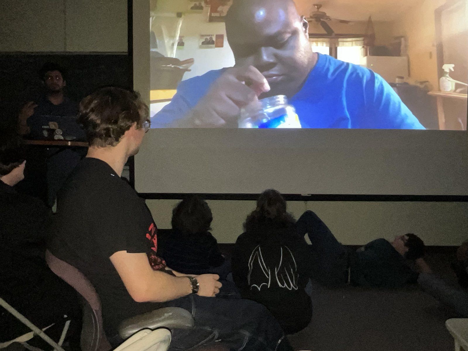 Alpha Phi Omega members watching a Fantastic Four movie night screening