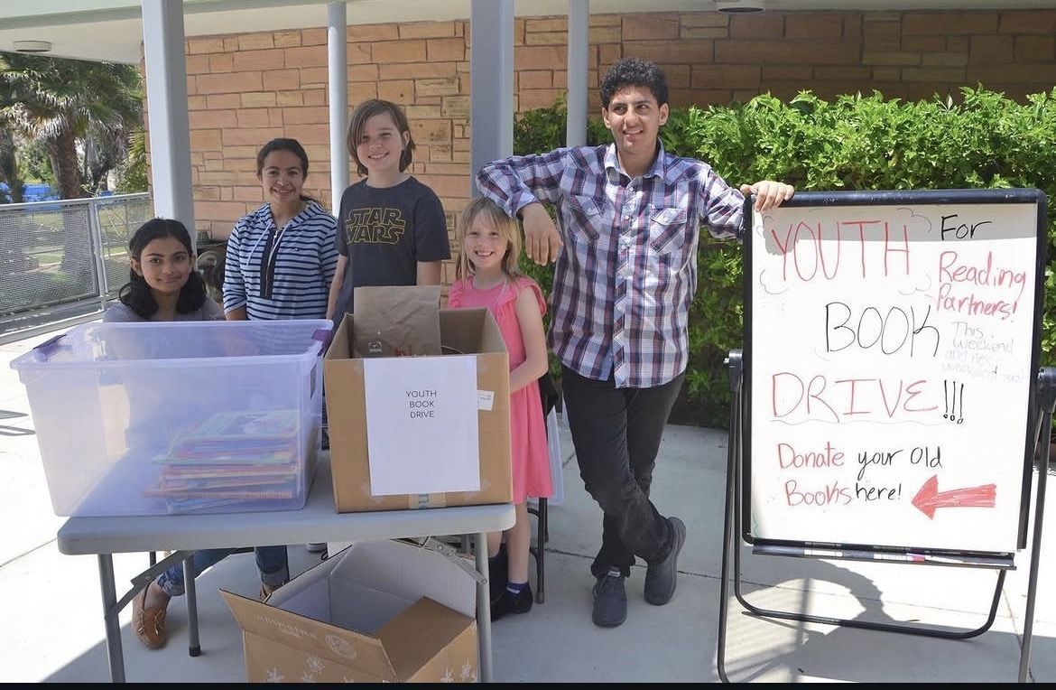 Youth group members at a book drive
