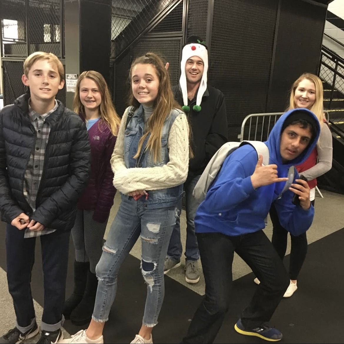 Youth group members ice skating at Toyota Center