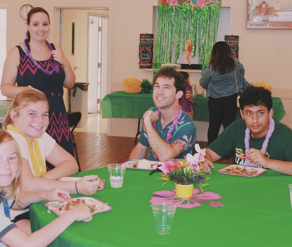 Youth group members at a luau