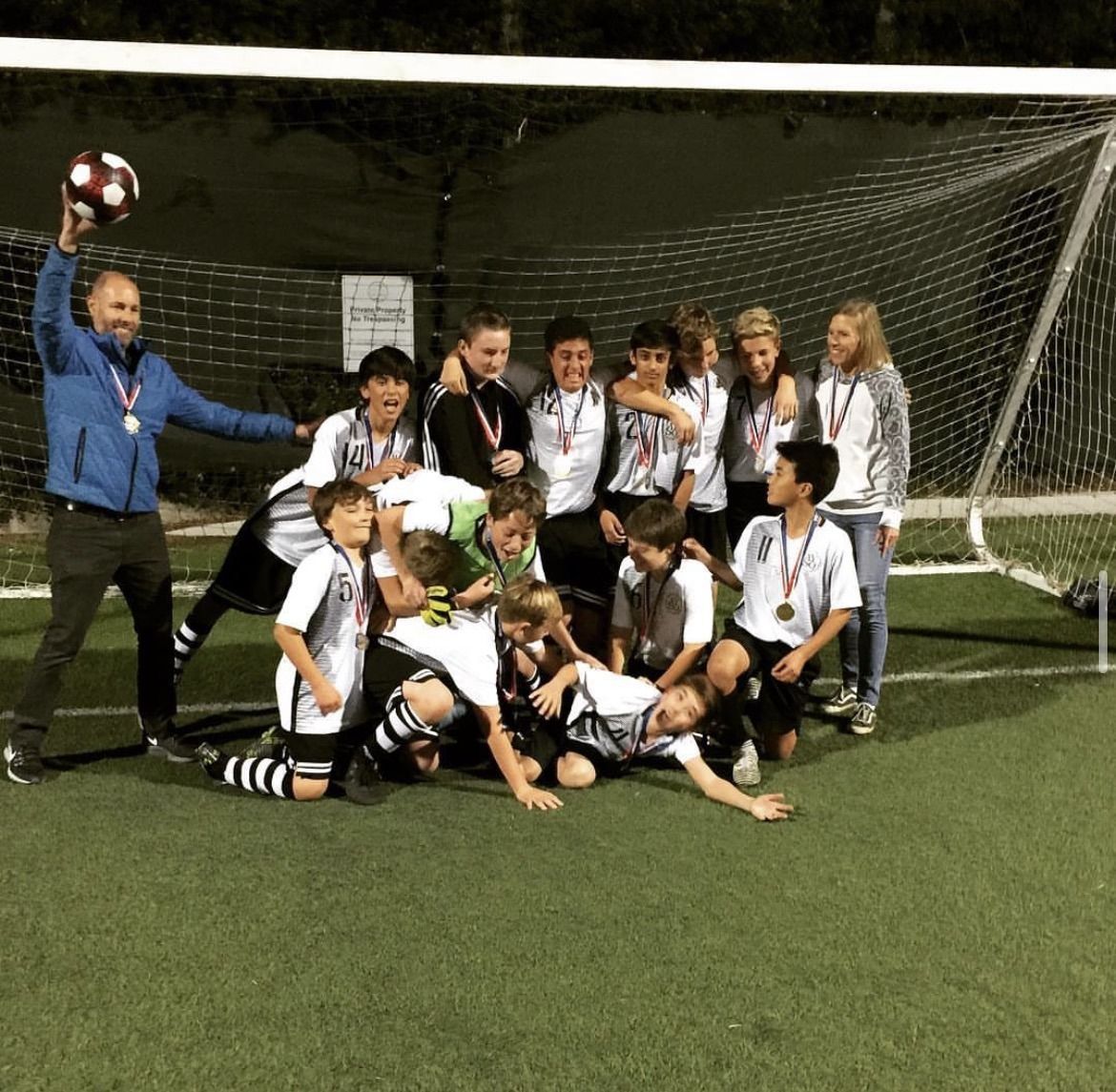 Armaan's AYSO team celebrating as regional champions
