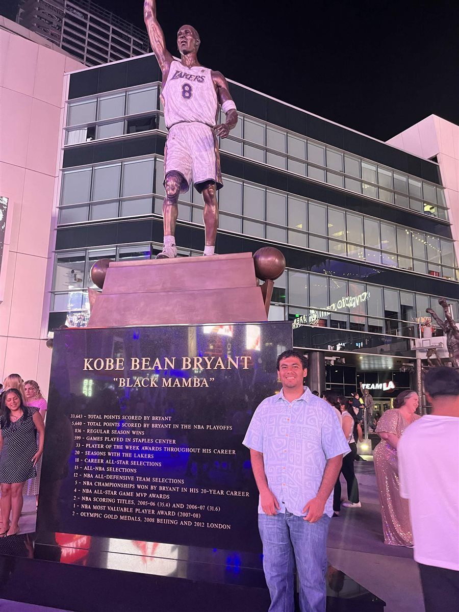 Armaan next to the Kobe Bryant statue outside Crypto.com Arena