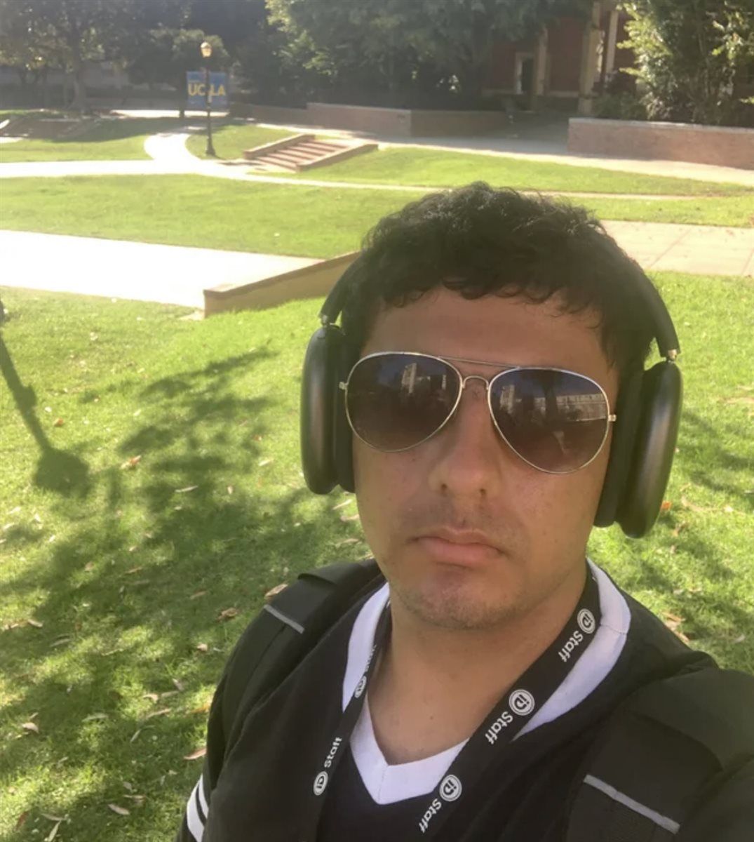 Armaan on the UCLA campus wearing an iD Tech staff lanyard